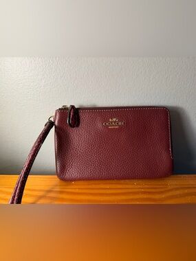 Coach Pebbled Leather Wristlet in Wine